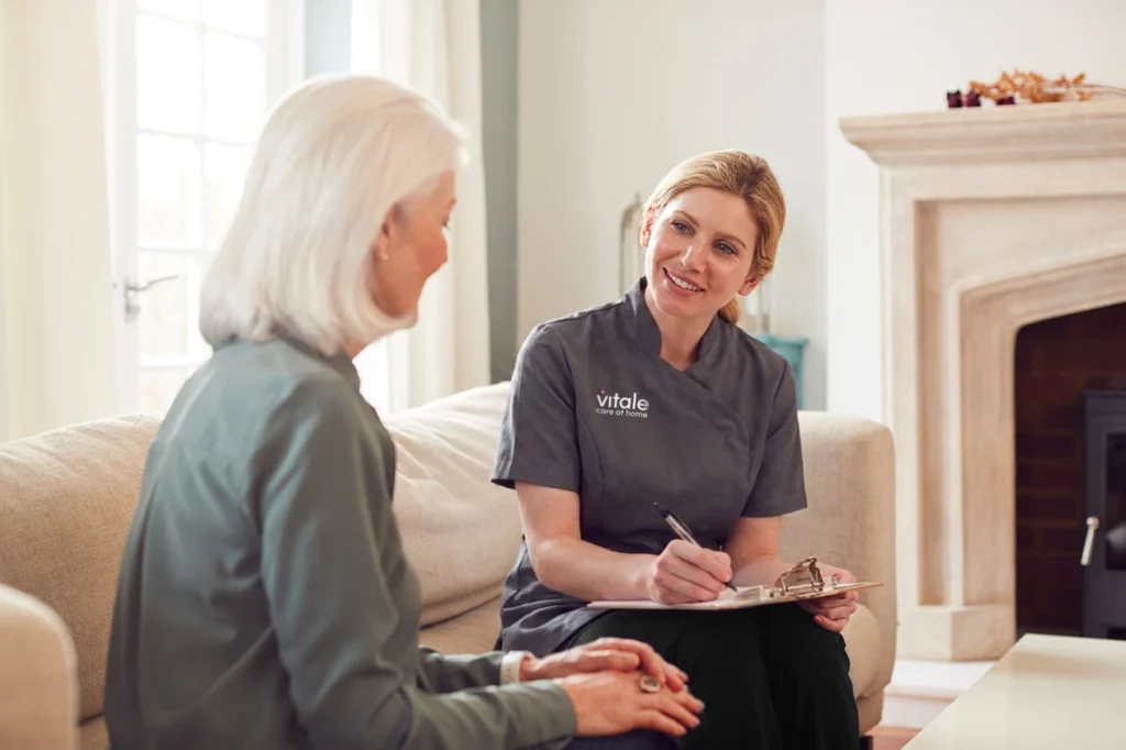Care Professional spending time with an older lady at home
