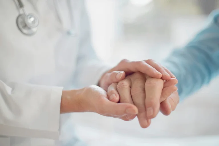 GP carrying out a Health review on elderly patient